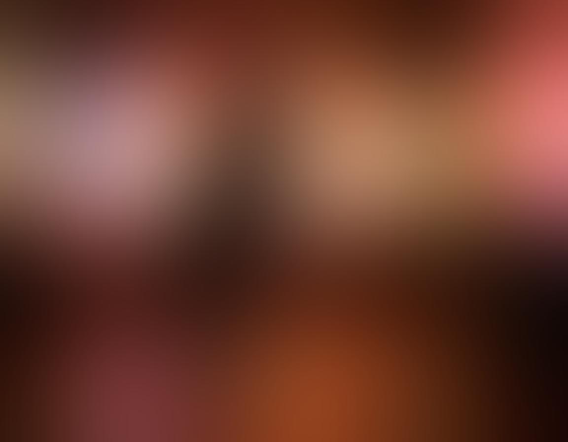 A captivating scene of a couple dancing in a dimly lit room, their silhouettes gracefully framed by soft, colorful lights that evoke passion and intimacy. Around them, blurred imagery of film reels and romantic scenes float, hinting at the narrative of explicit media. The atmosphere is charged with emotion and desire, emphasizing connection and affection. dreamy, ethereal, super-realistic, vibrant colors.